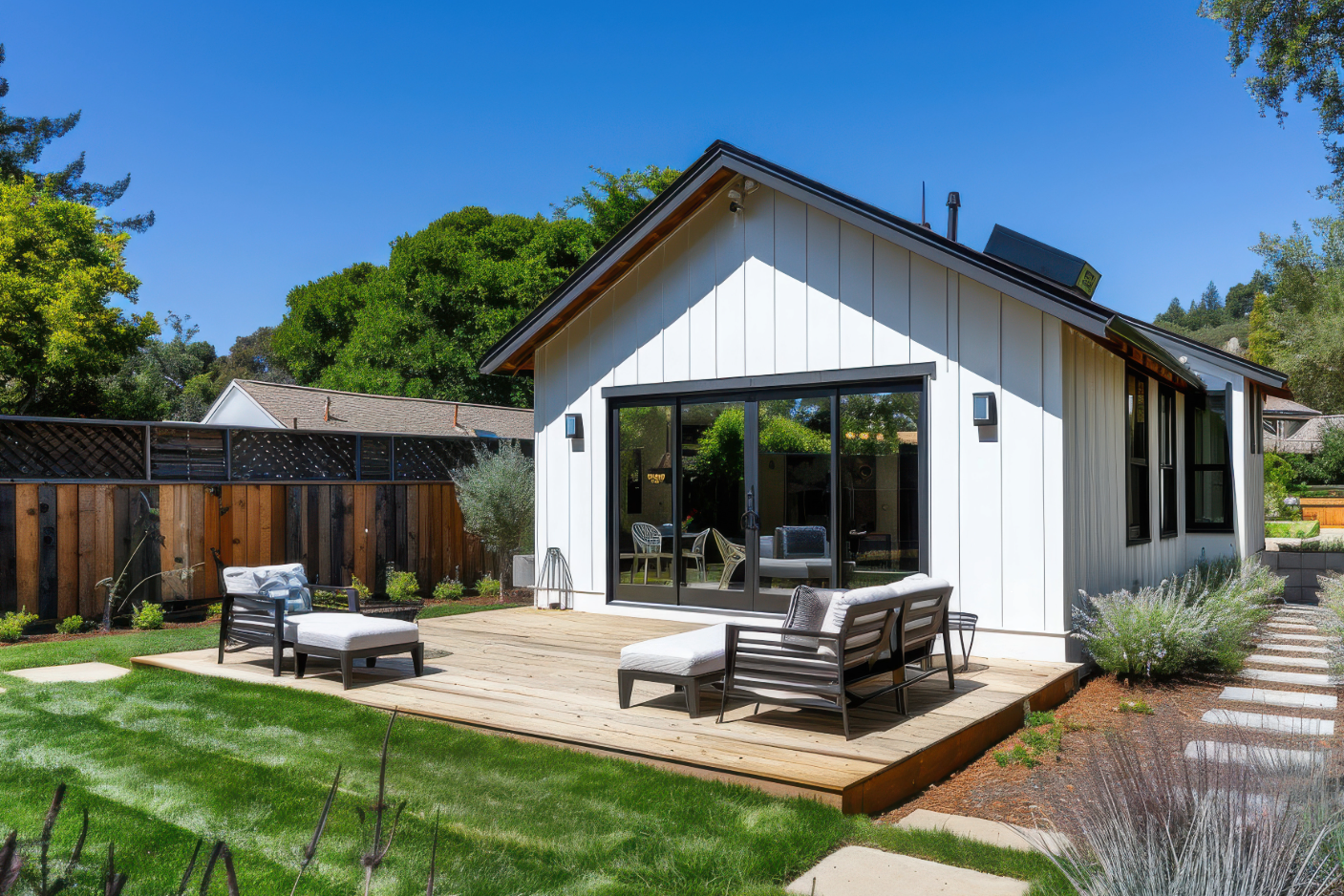 a small white dwelling with wooden porch